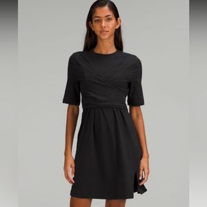 LULULEMON Black Cotton Wrap-Front T-Shirt Dress in black. New with tags. Size 12
